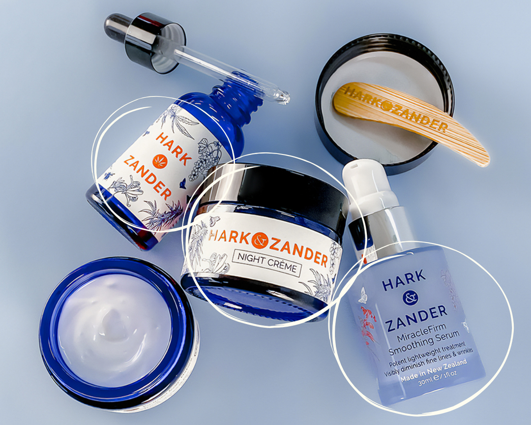 Hark & Zander skincare products including cream, serum, and dropper on a light blue background